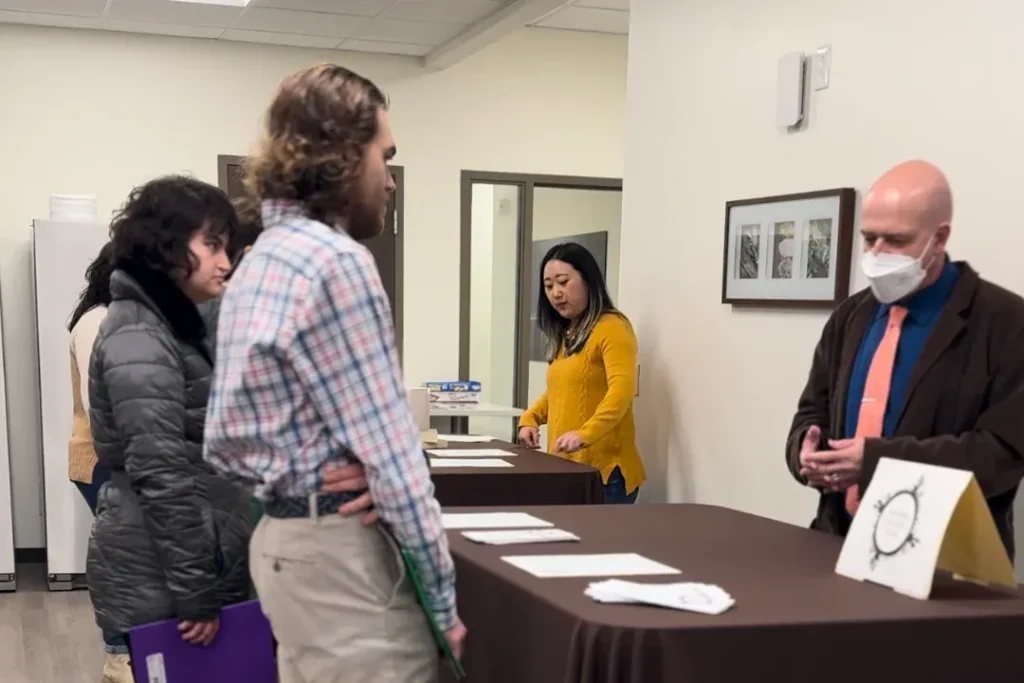 OPTIONS admissions information table during a program visit or community event