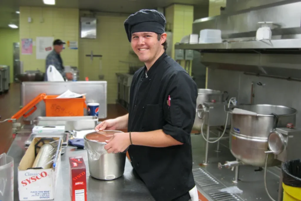 OPTIONS student building food service skills during a community work experience