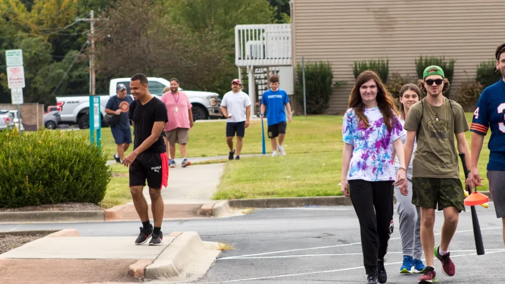 Students walking through the OPTIONS campus and community during a program visit